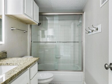 Bathroom is upgraded with granite countertops, ple