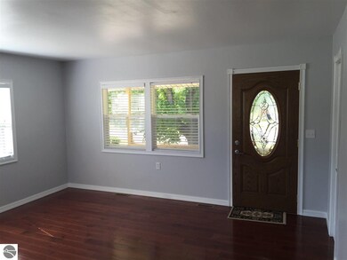 New Hardwood Flooring, Paint and Trim. Beautiful Front Door!