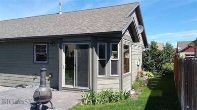 Backyard patio and view of the dining room bay win