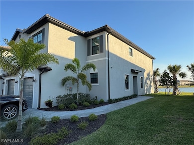 View of property exterior with a lawn, stucco sidi