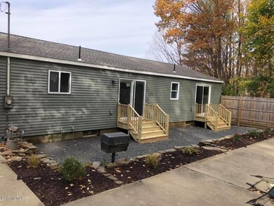 Backstairs to landscaping & new vinyl ou