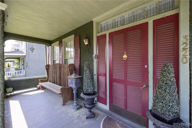 Property entrance with covered porch