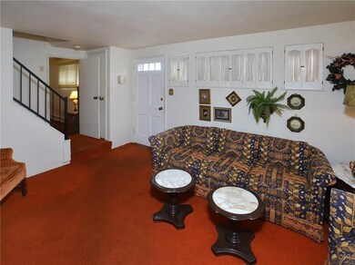 The Living Room Features Shuttered Windows, with C