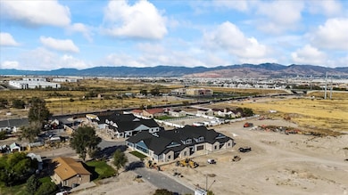 Aerial perspective of suburban area featuring a mountainous background