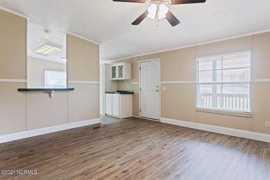 Living Room to Front Door and Kitchen
