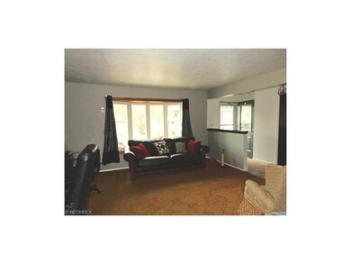 This spacious 15x14 living room has a lot of natur