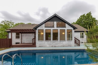 This inviting space features a sunroom with beautiful views and its own private deck—perfect for morning coffee or evening sunsets by the pool.