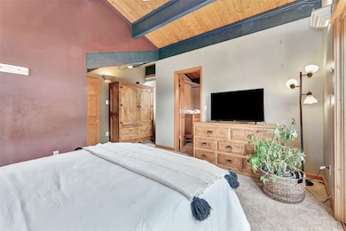 Primary suite with private balcony access and warm