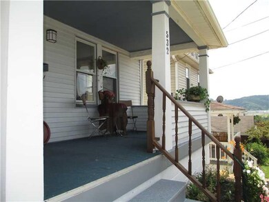 Exterior Front. FRONT GARDEN AND PORCH
