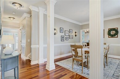 As you enter the home, you'll notice the high ceilings and gorgeous trim throughout.  The entry opens into the dining room and hall to the left leads to primary bedroom, great room, and stairway to additional bedrooms.