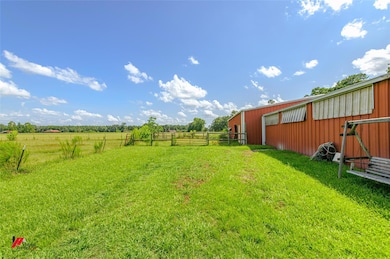 Rear view of horse barn looking over pasture