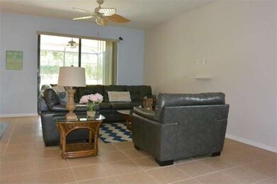 SPACIOUS LIVING ROOM WITH TILE FLOORS