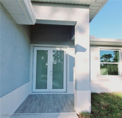 Doorway to property with french doors