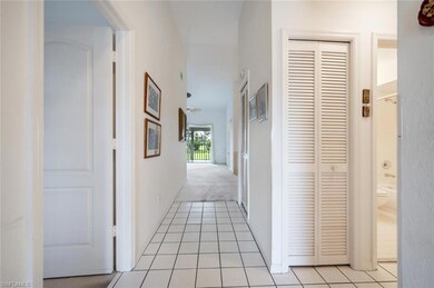 Hall with light tile patterned floors
