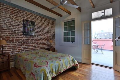 Primary bedroom, looking towards private deck