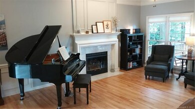 Well appointed great room with trim moldings, fire