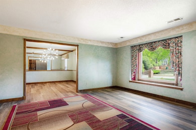 Unfurnished room with a textured ceiling, visible 