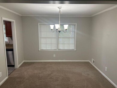dining room off living room and kitchen to the lef