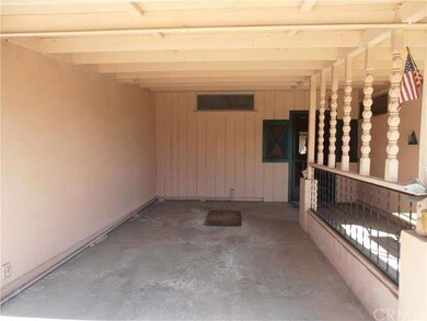 Large covered car port or patio.