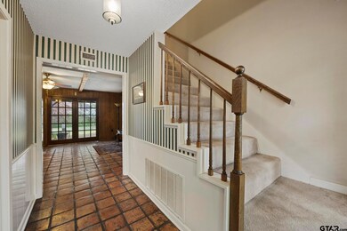 Saltillo flooring just inside front door & perfect banister for all holiday decor...:)