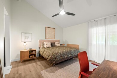 Bedroom featuring baseboards, a ceiling fan, ligh