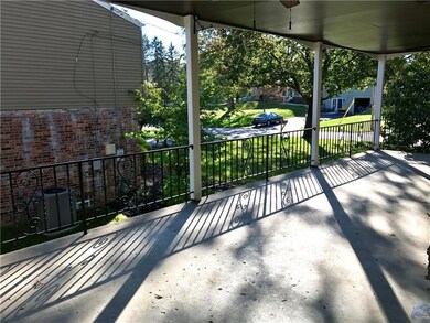 26x12 poured concrete covered porch includes two p
