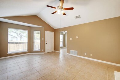 Unfurnished room with visible vents, ceiling fan,