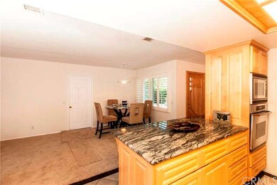 One side of kitchen is open to dining area.  Direc