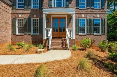 Entrance to property featuring brick siding