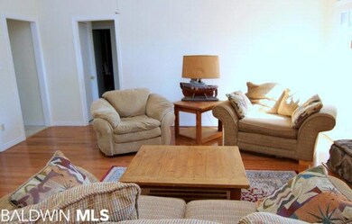 Spacious room with wood floors and fireplace. 16x1