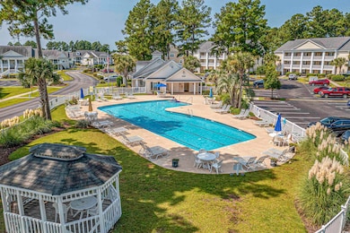 View of swimming pool featuring a yard and a patio