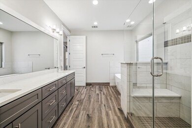 The spa-like primary bath is a welcome retreat. St
