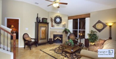 living room of model: Photo is of this same plan of the model home. Options and upgrades will vary to subject home.