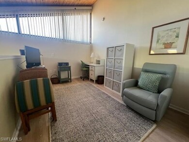 Living area with light wood-style floors and baseb