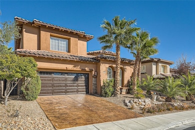 Mediterranean / spanish home with a garage, a tile