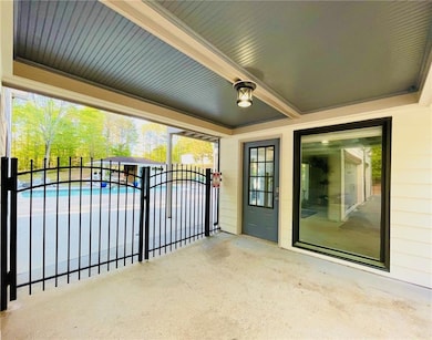 Gate featuring a patio area