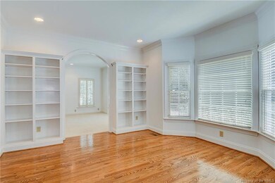 Formal dining or office with built-in cabinets, ba