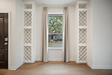 Entryway with wood finished floors and baseboards