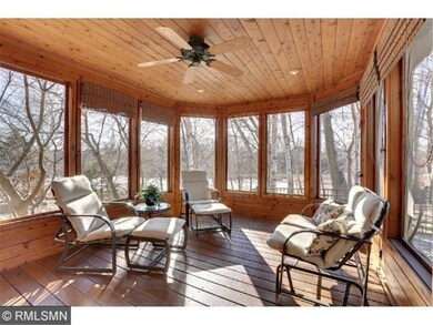 Window wrapped screen porch with elegant French do