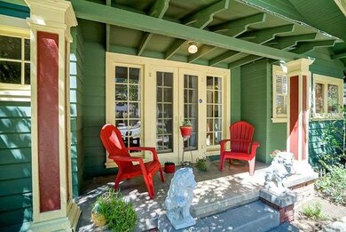 Charming side patio off the formal dining room. 