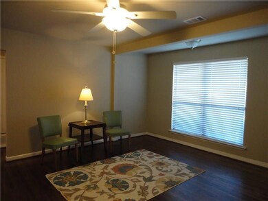 Large living area with good natural light, ceiling