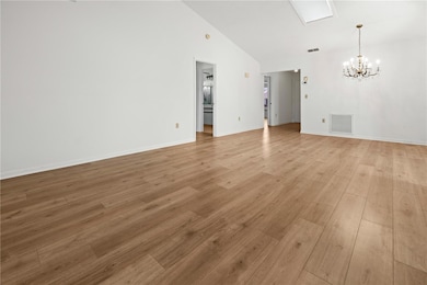 VIEW FROM THE LVING ROOM SLIDING DOOR TOWARDS THE DINING AREA. PRIMARY ENSUITE IS ON THE LEFT