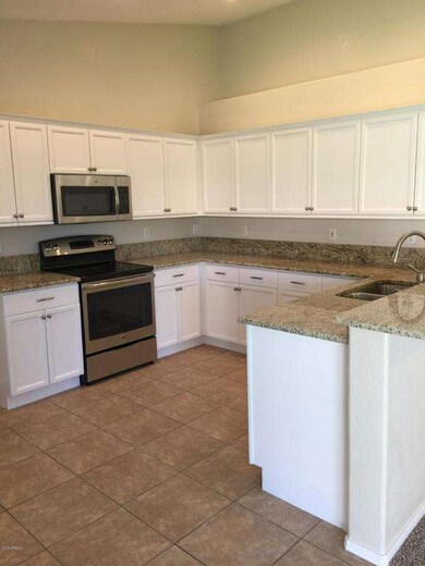 Kitchen w/ granite tops