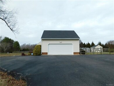 Large 2 car garage with ample storage cabinets.