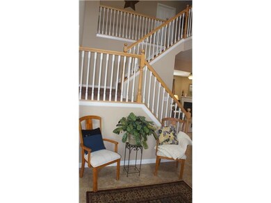 Entry. Beautiful wood banister in the foyer.