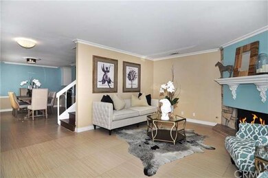 Cozy fireplace and open to formal dining, great fo
