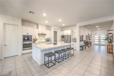 Kitchen with stainless steel appliances, light til