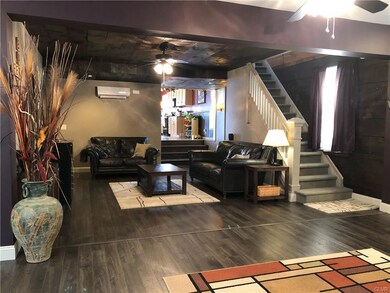 Enter home with open floor plan.