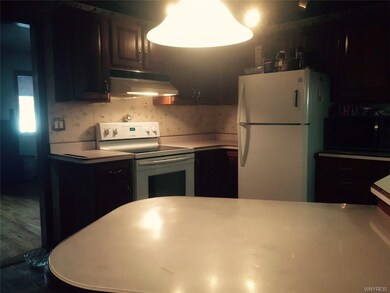 Large peninsula, cherry cabinets newer appliances 