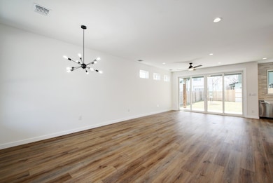 Unfurnished living room featuring recessed lighti